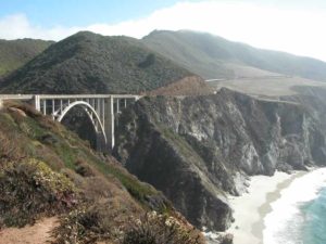Bixby Bridge stretches 700' long to cross the deep Bixby Creek Canyon. The headlands south are on the Brazil Ranch.