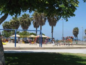 A large sandy playground near the picnic area.