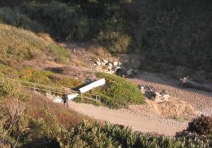 Parking and restrooms on a low bluff above the beach.